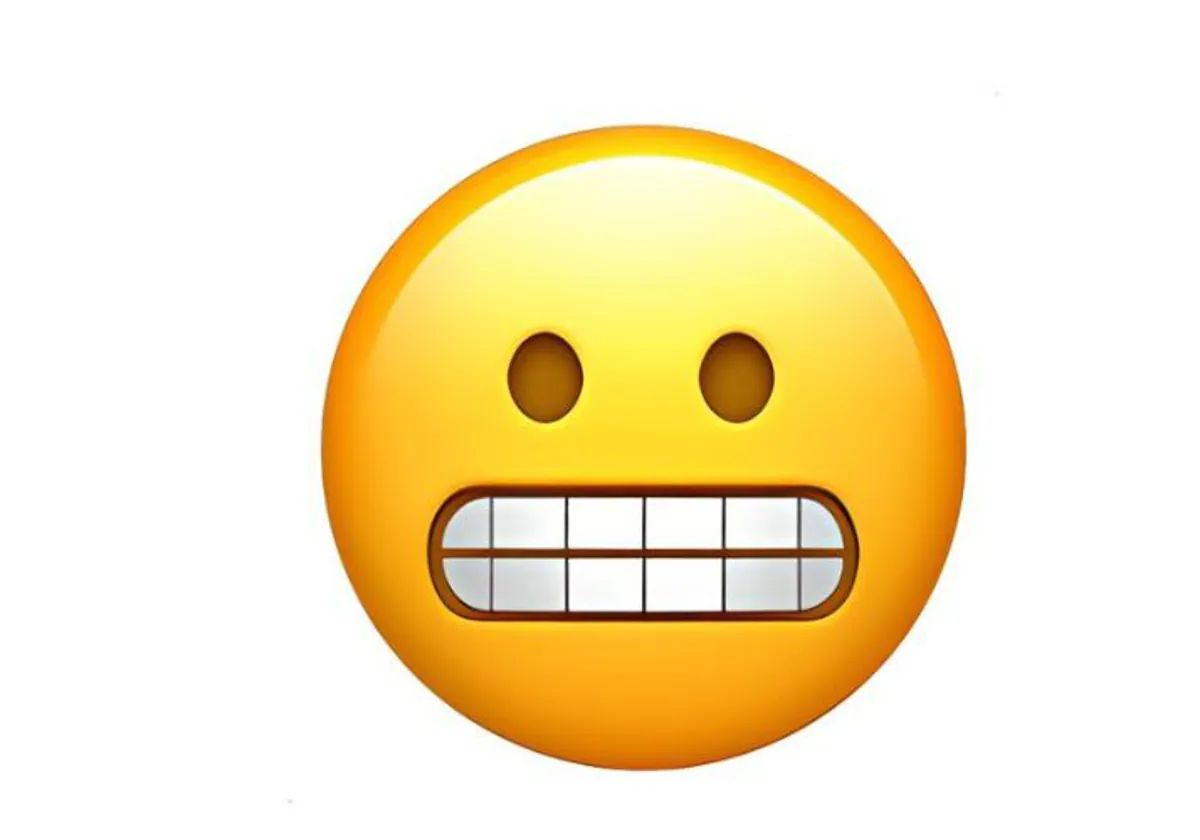 Qu significa la carita con los dientes apretados en WhatsApp